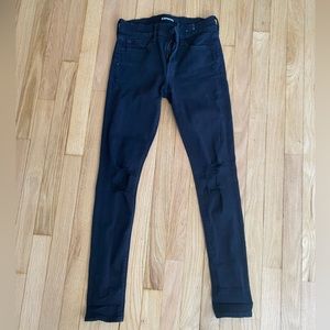 Black mid-rise ripped skinny jeans